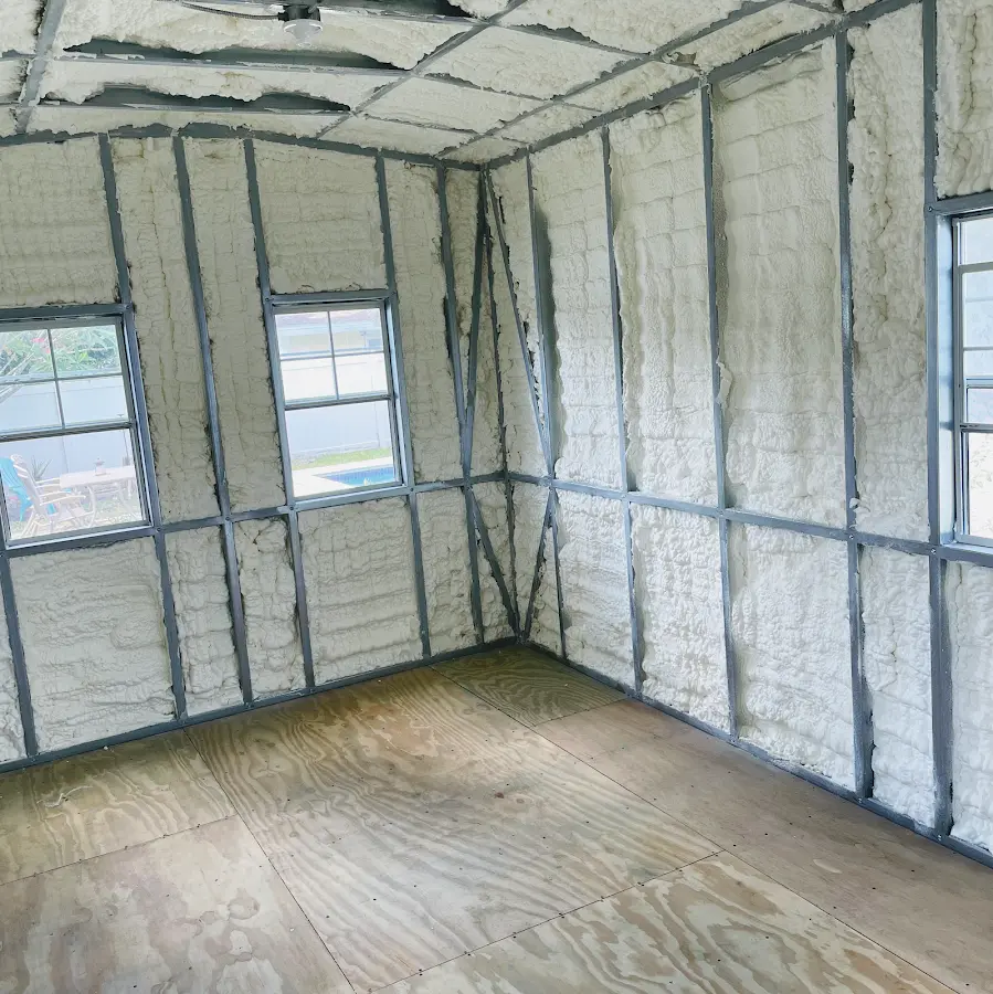 Closed-cell spray foam insulation applied to wall cavities in a residential project in Meadowbrook